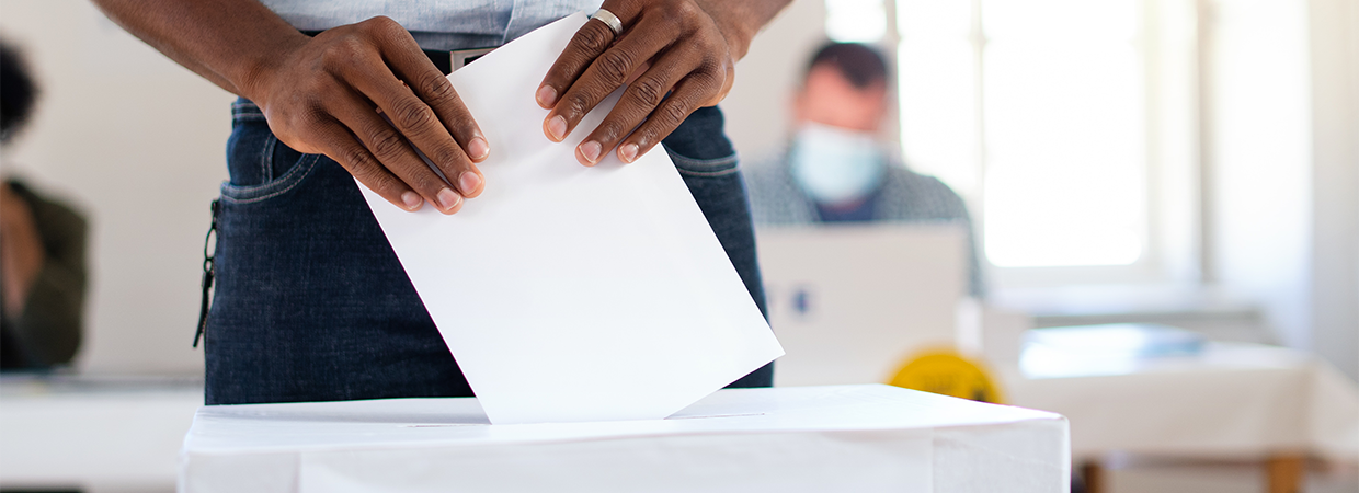 Person voting with a ballot