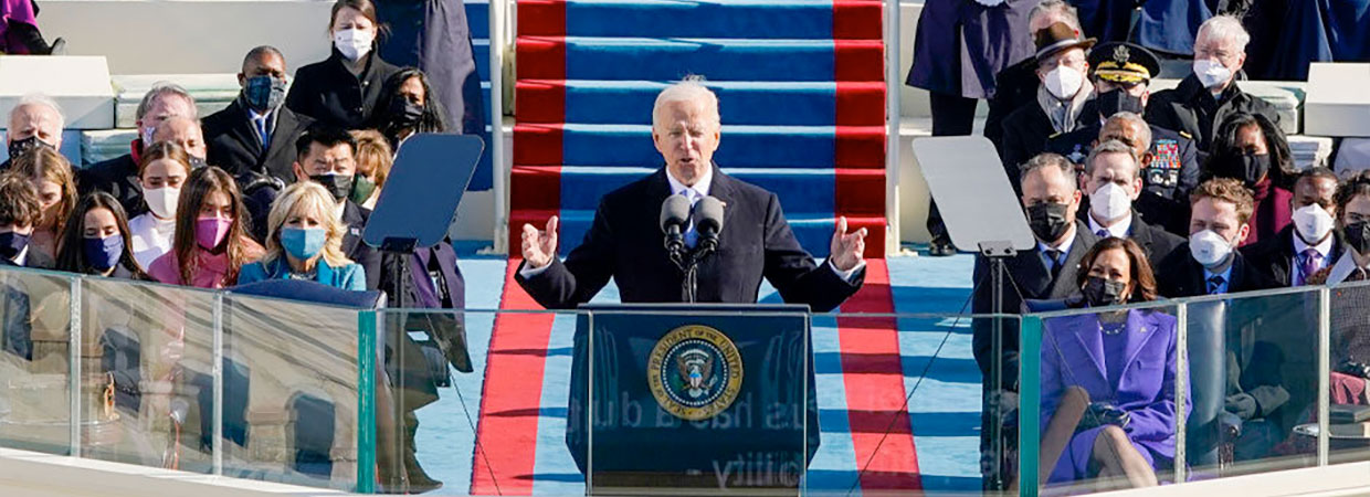 President Joe Biden speaking at podium at his inauguration.